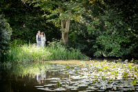 Wonderful wedding at the magnificent Kenwood Hall in Sheffield. Our couple are seen together from across the lake.