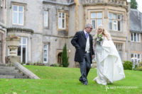 Kenwood Hall Sheffield wedding as our newly married couple take a strole around the grounds in front of Kenwood Hall